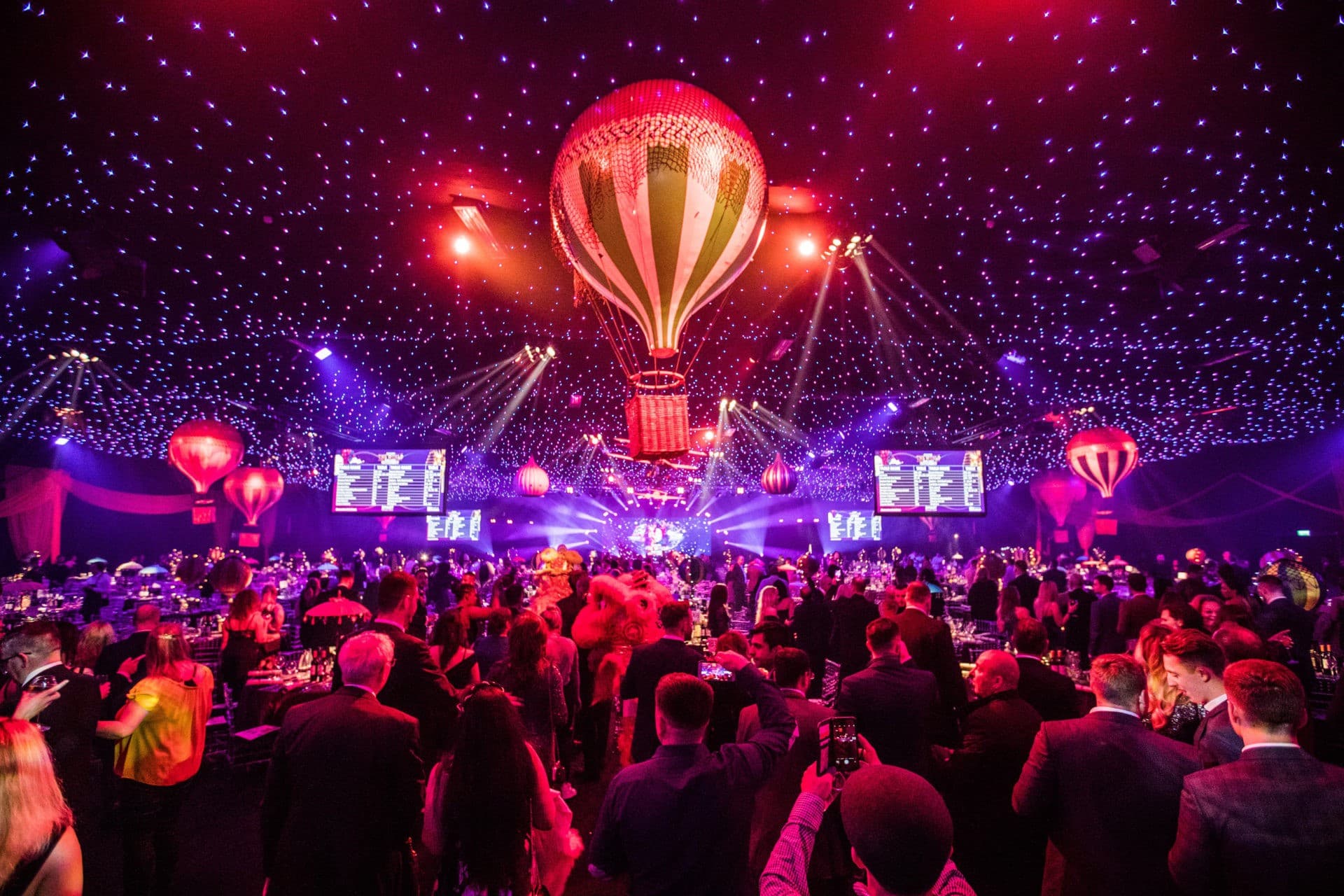 An event inside Evolution London with illuminated balloon decorations