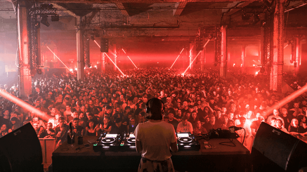 A DJ performing to the crowd at The Warehouse Project